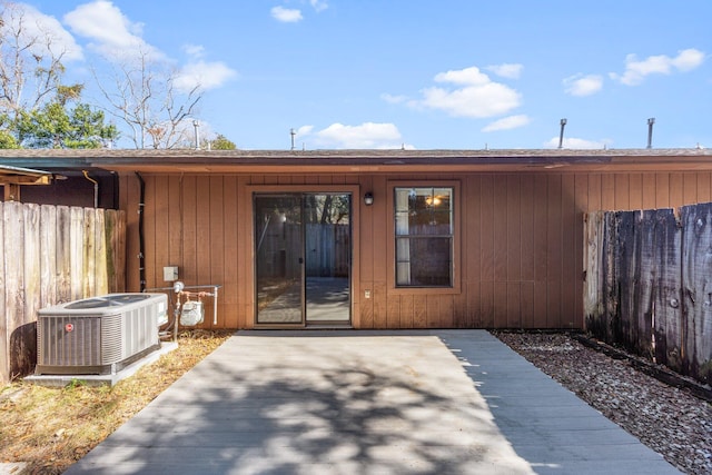 back of property featuring a patio and cooling unit