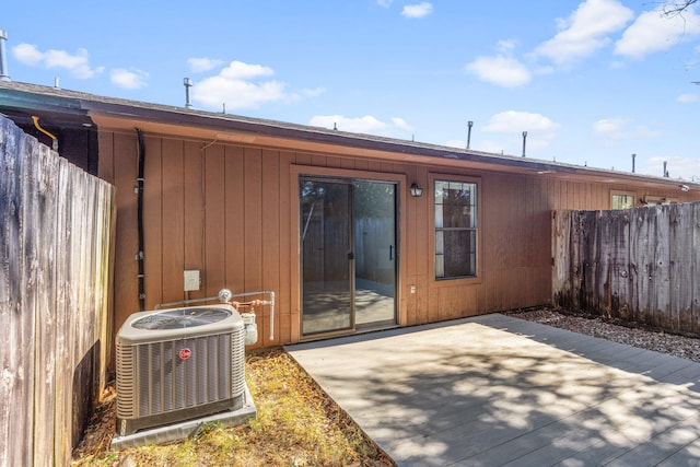 back of property featuring a patio and cooling unit