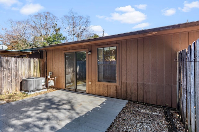 rear view of property featuring a patio, a deck, and central air condition unit