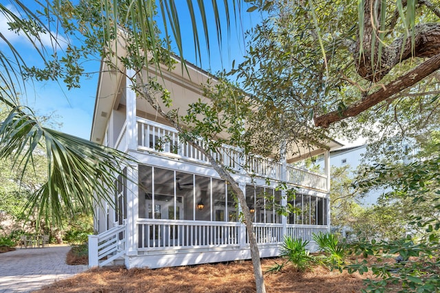 exterior space featuring a sunroom