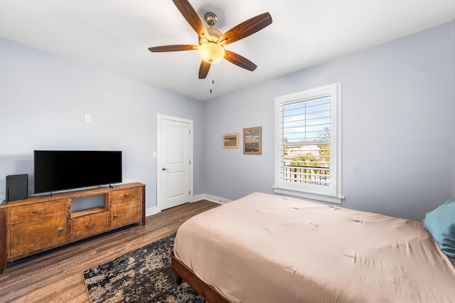 bedroom featuring hardwood / wood-style flooring and ceiling fan