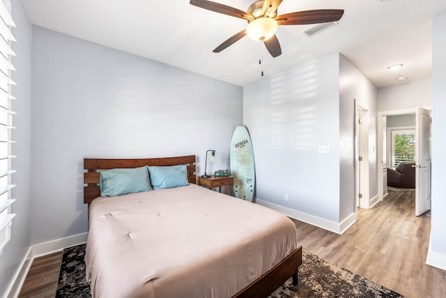 bedroom featuring hardwood / wood-style flooring and ceiling fan