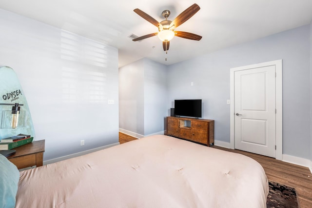 bedroom featuring wood-type flooring and ceiling fan