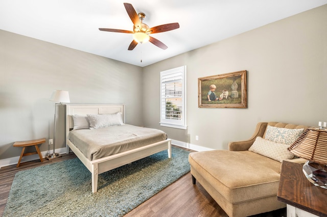 bedroom featuring dark wood-type flooring and ceiling fan