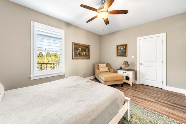 bedroom featuring hardwood / wood-style flooring and ceiling fan