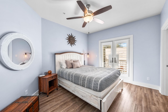 bedroom featuring french doors, ceiling fan, dark hardwood / wood-style flooring, and access to outside