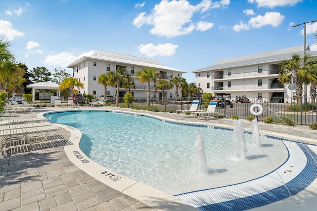 view of pool with pool water feature