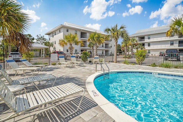 view of swimming pool with a patio area