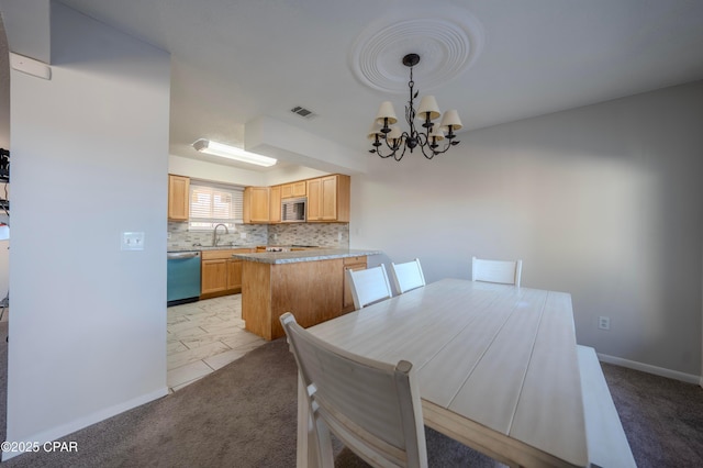 carpeted dining room with a notable chandelier and sink