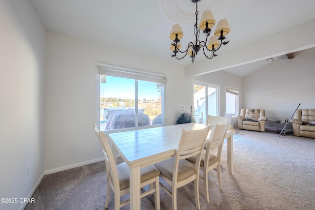 carpeted dining room with a chandelier and lofted ceiling with beams