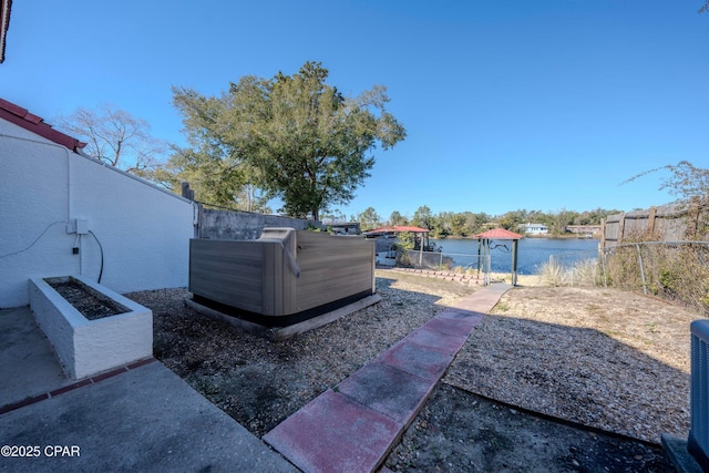 view of patio featuring a water view