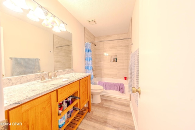 full bathroom featuring toilet, vanity, shower / bath combo, and hardwood / wood-style flooring