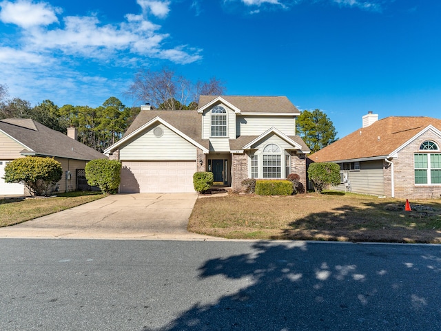 front of property with a garage and a front yard