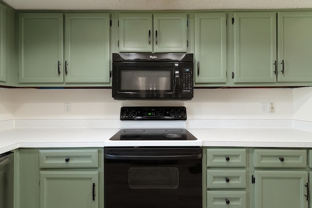 kitchen with stainless steel dishwasher, green cabinets, and electric stove