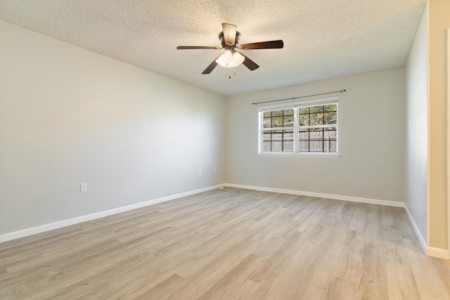 spare room with ceiling fan, a textured ceiling, and light hardwood / wood-style flooring