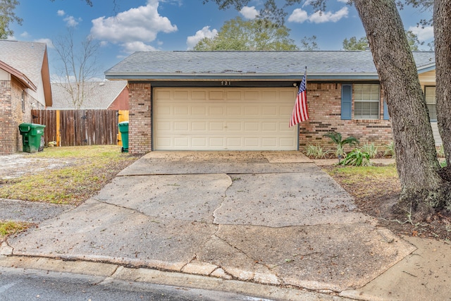 ranch-style house featuring a garage