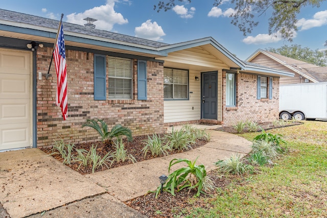 single story home with a garage