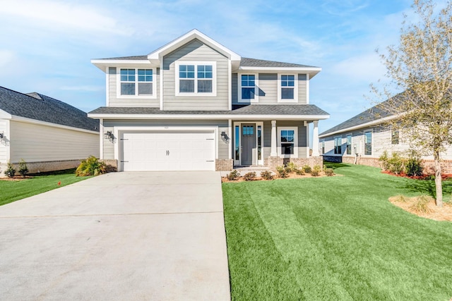 view of front of house featuring a front yard, a garage, and covered porch