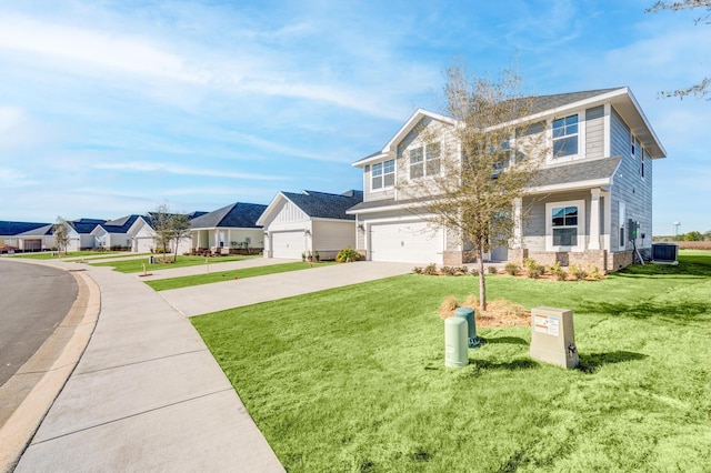 view of front of home with central AC unit, a garage, and a front lawn