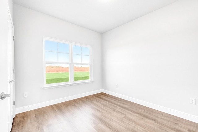 spare room featuring light hardwood / wood-style floors