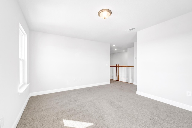 spare room featuring carpet floors