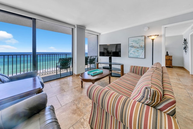 tiled living room featuring expansive windows and a water view