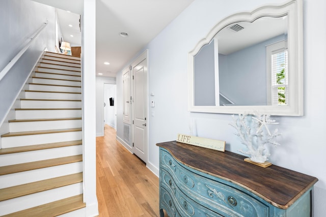 staircase with wood-type flooring