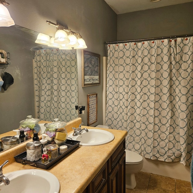 full bathroom featuring shower / bath combination with curtain, tile patterned floors, toilet, and vanity