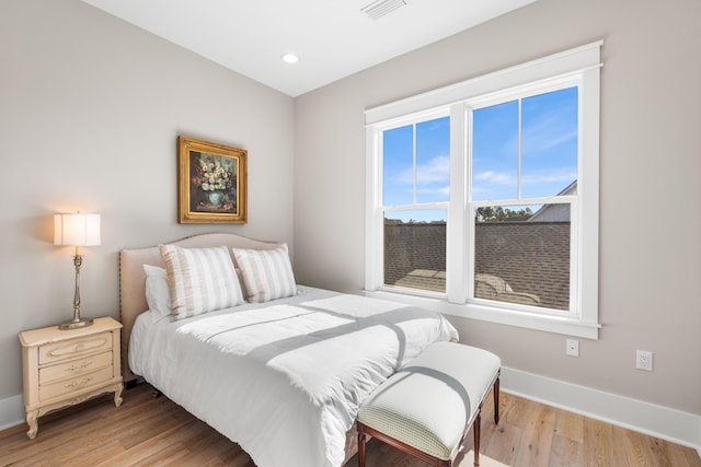 bedroom with light hardwood / wood-style floors