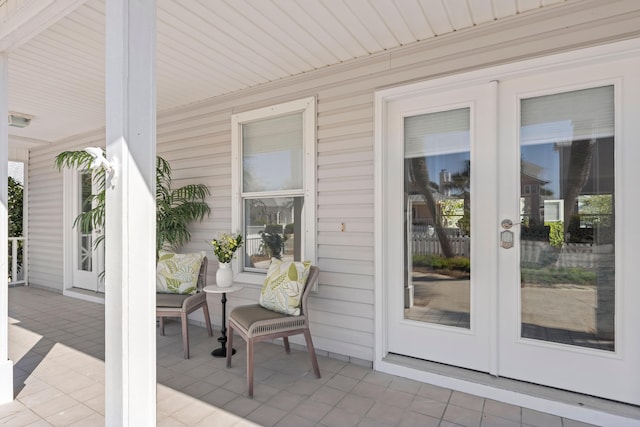 view of patio featuring covered porch and french doors