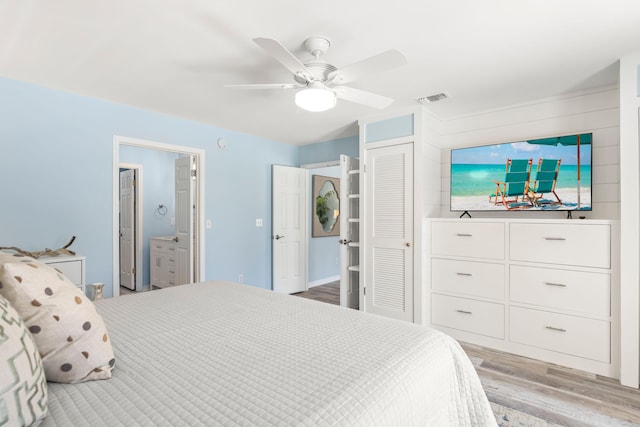 bedroom with a ceiling fan, a closet, visible vents, and light wood-style floors