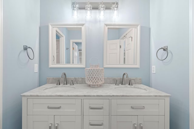 full bath with double vanity and a sink