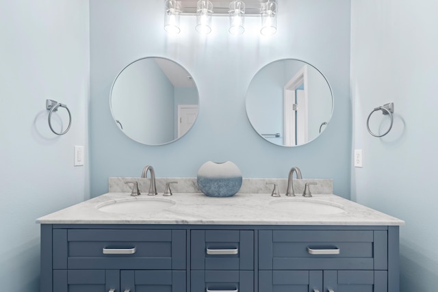 full bath featuring a sink and double vanity