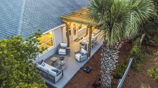 view of patio / terrace featuring an outdoor hangout area, a deck, and outdoor dining space