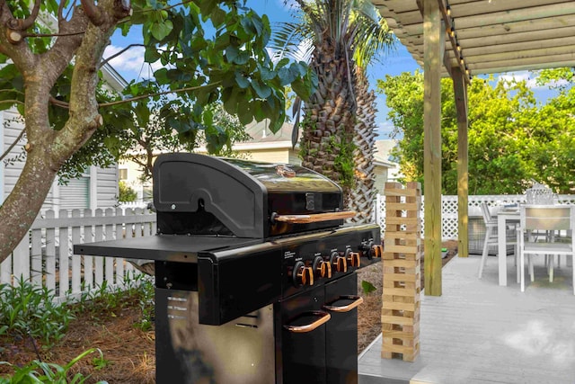 exterior space with outdoor dining space and fence