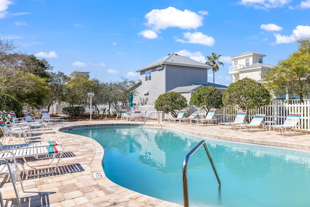 pool with fence and a patio