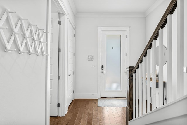 interior space with ornamental molding and dark hardwood / wood-style flooring