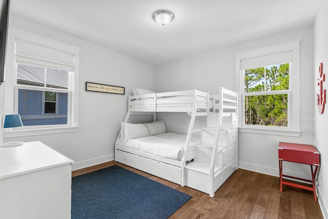 unfurnished bedroom with dark hardwood / wood-style floors