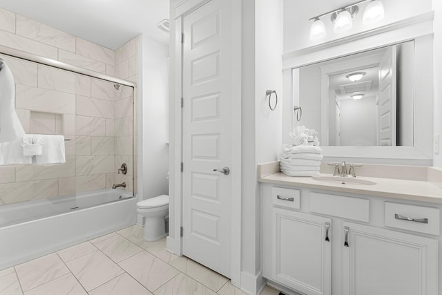 full bathroom featuring toilet, bath / shower combo with glass door, and vanity