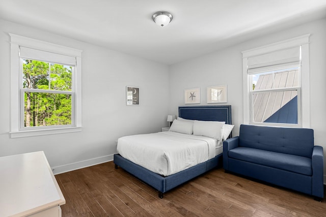 bedroom featuring dark hardwood / wood-style flooring