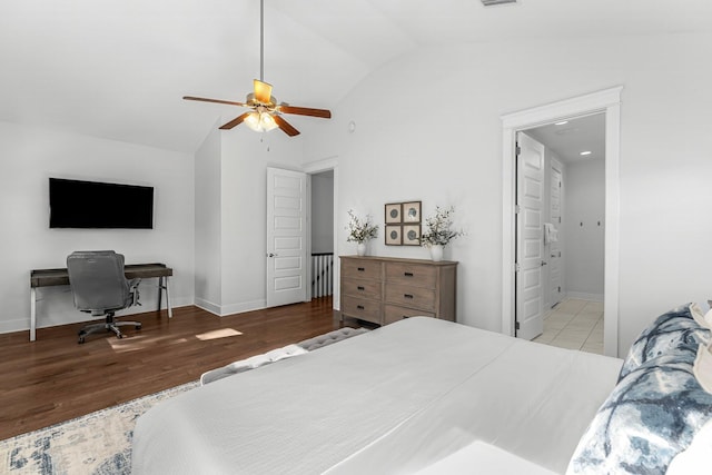 bedroom featuring lofted ceiling, ensuite bathroom, ceiling fan, and light hardwood / wood-style floors