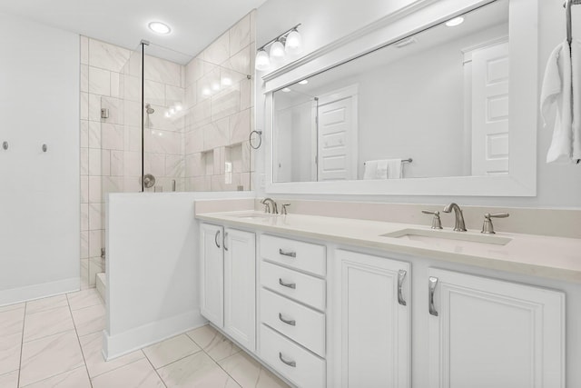 bathroom with tiled shower and vanity