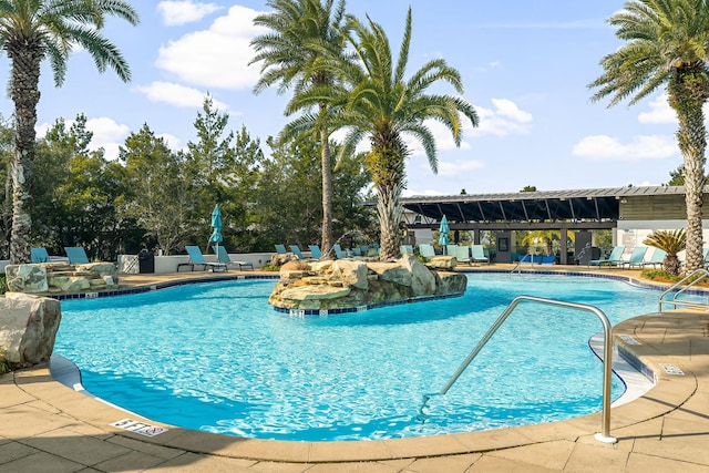 view of swimming pool featuring a patio