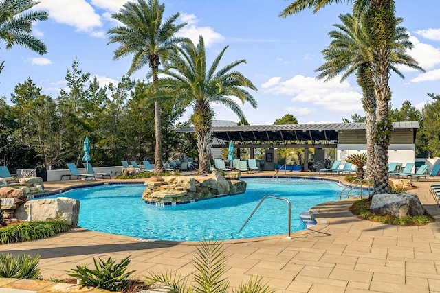 view of swimming pool featuring a patio area