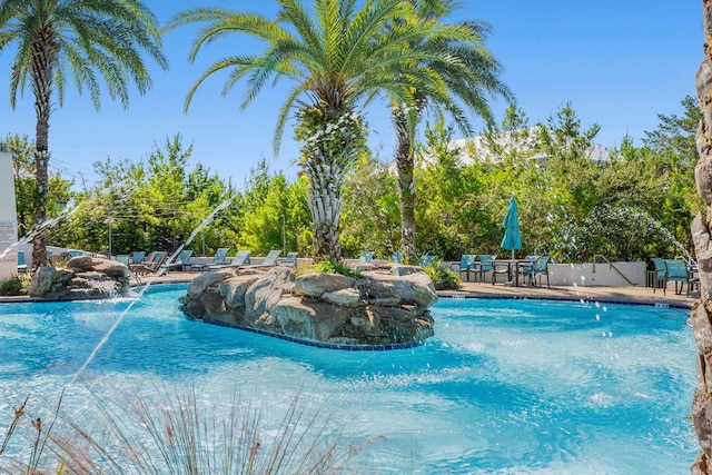 view of pool with pool water feature