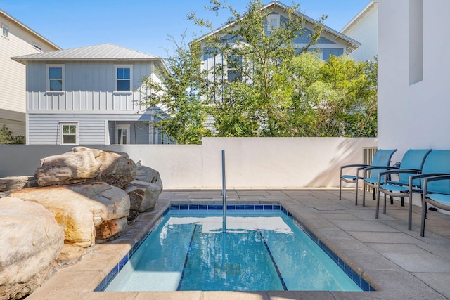 view of swimming pool featuring a patio