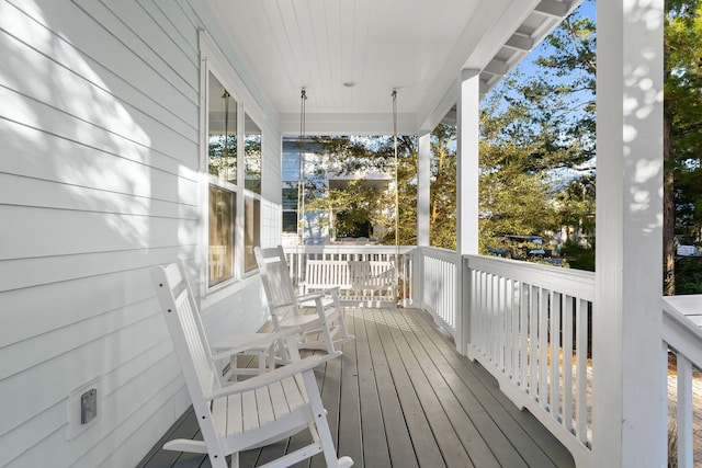 wooden terrace with a porch