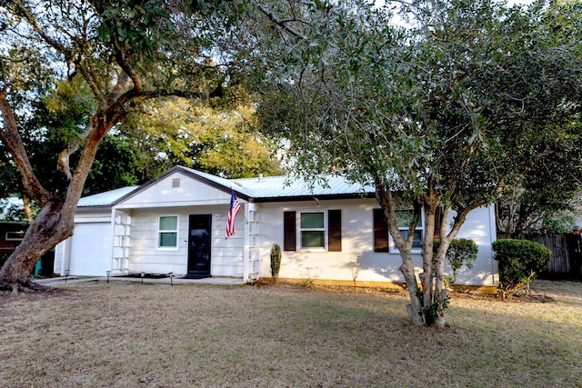 ranch-style home featuring a garage