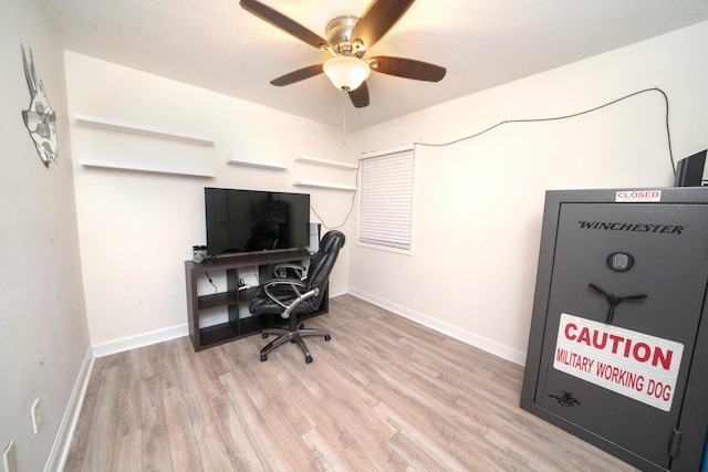 office space featuring ceiling fan and light wood-type flooring