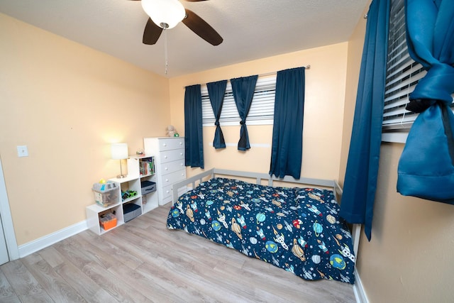 bedroom featuring ceiling fan and light wood-type flooring